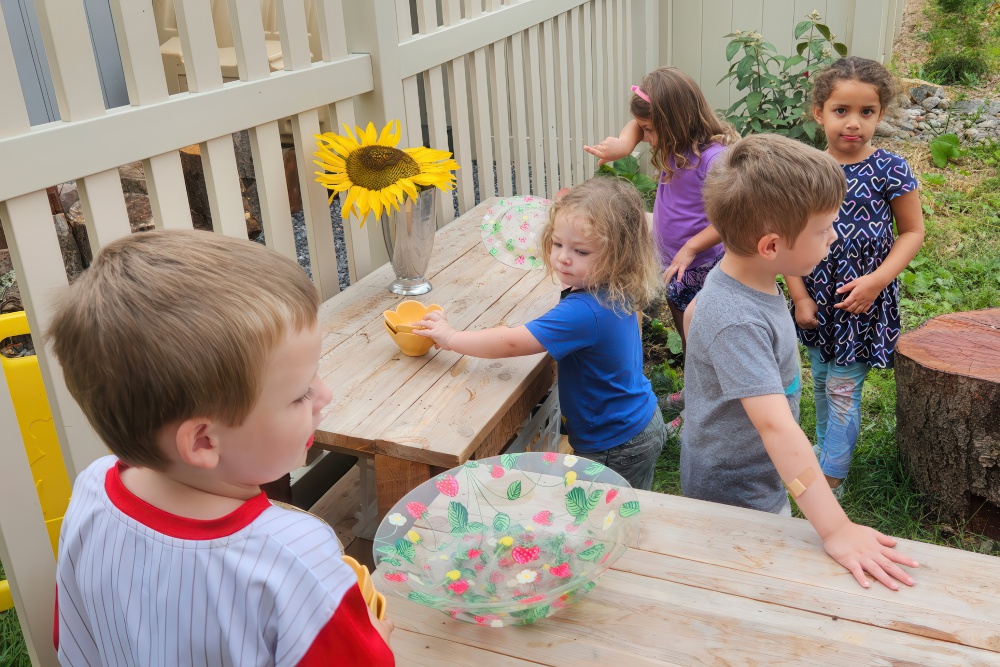 Several children happily playing outdoors, enjoying their time together in a vibrant and sunny environment.